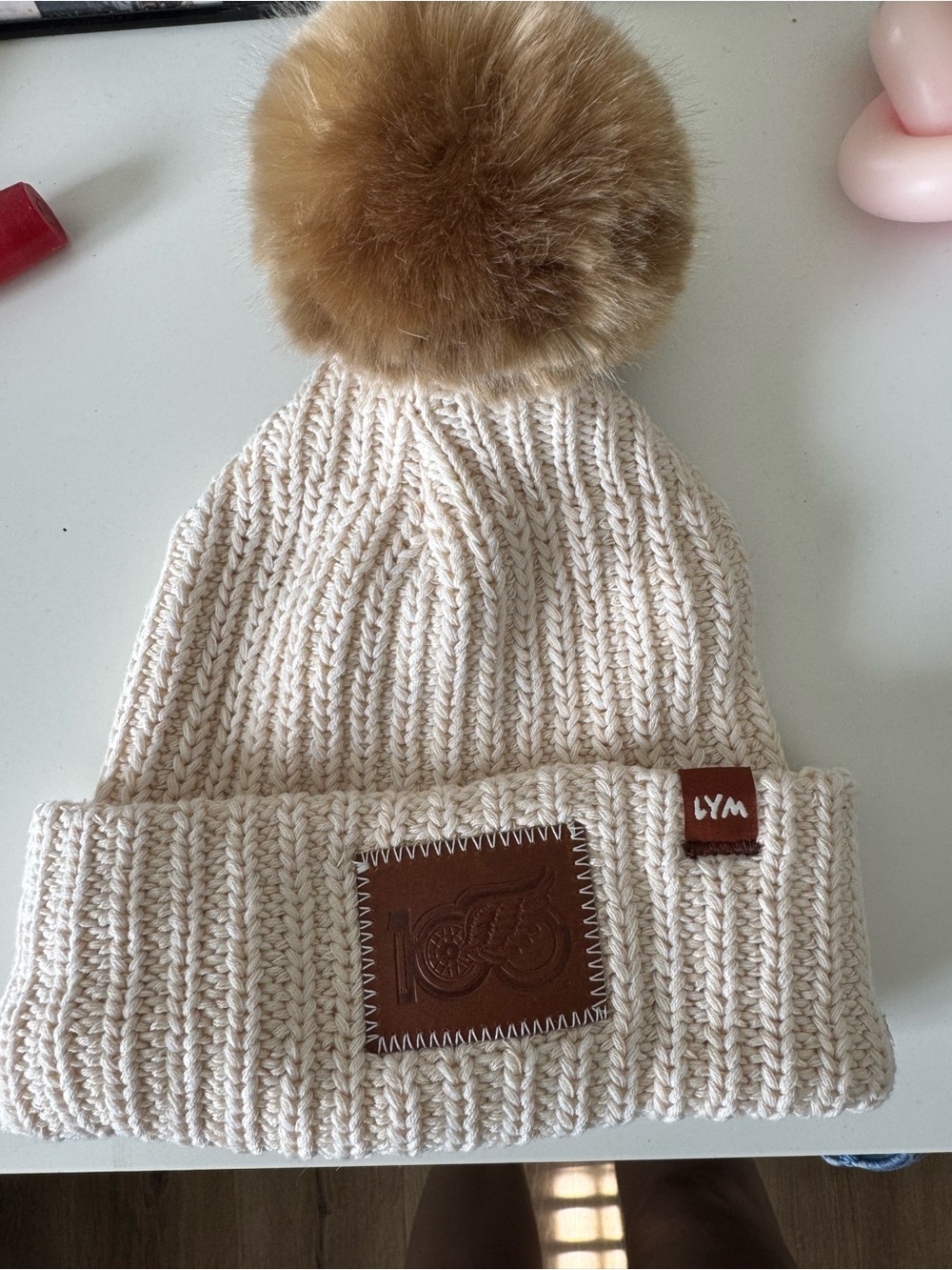 Love Your Melon Detroit Red Wings Cream Knit Beanie with Brown Faux Fur Pom